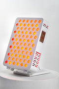 Ultra Mini 100 red light therapy panel on its stand, switched on, three-quarter view