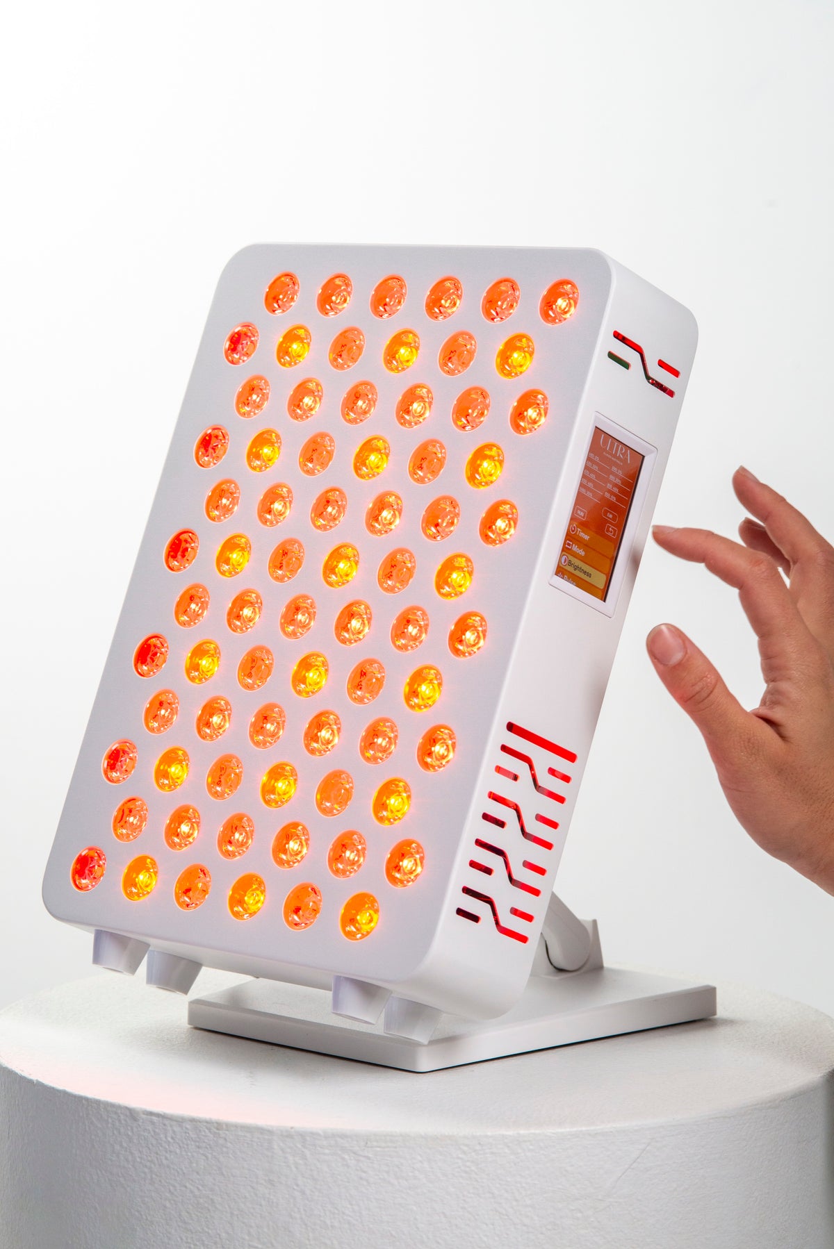 Hand adjusting the Ultra Mini 100 touchscreen